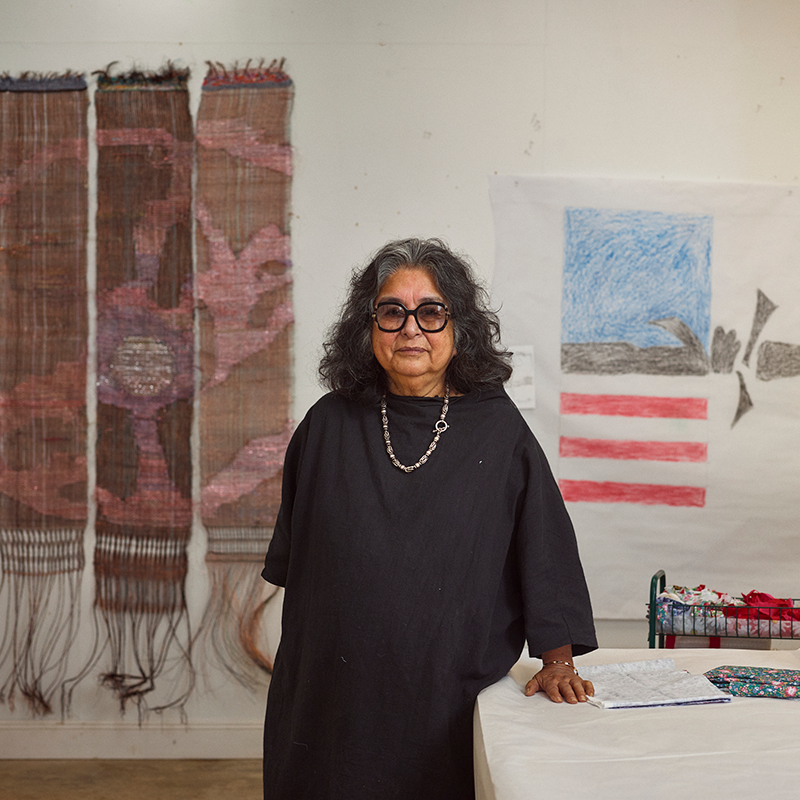 Fiber artist Consuelo Jiménez Underwood with an immersive textile installation incorporating wire and woven patterns.