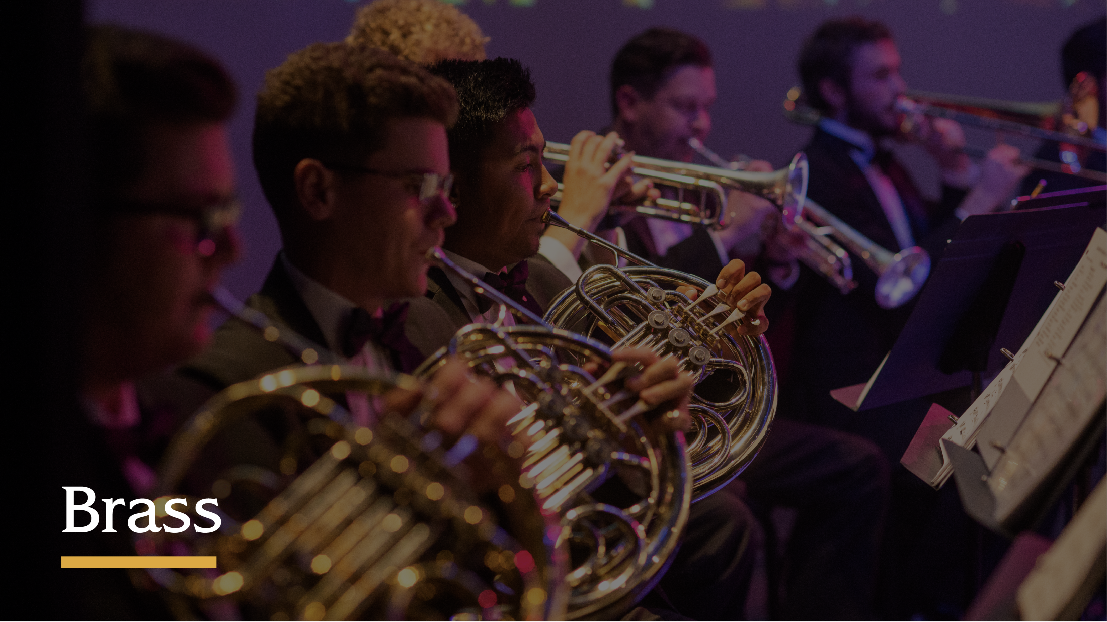 Group of students playing brass instruments.