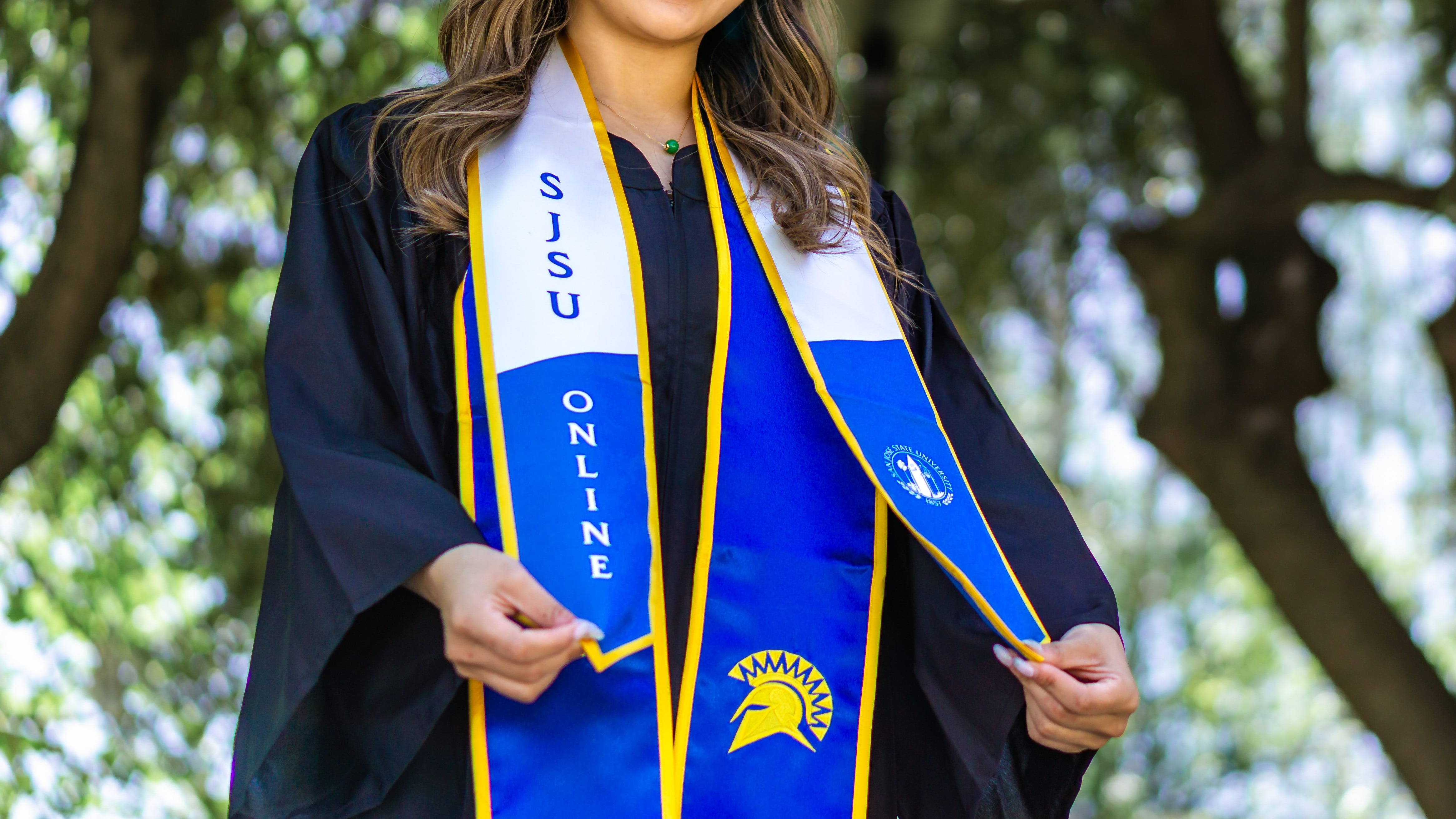 Female graduate looking towards sun