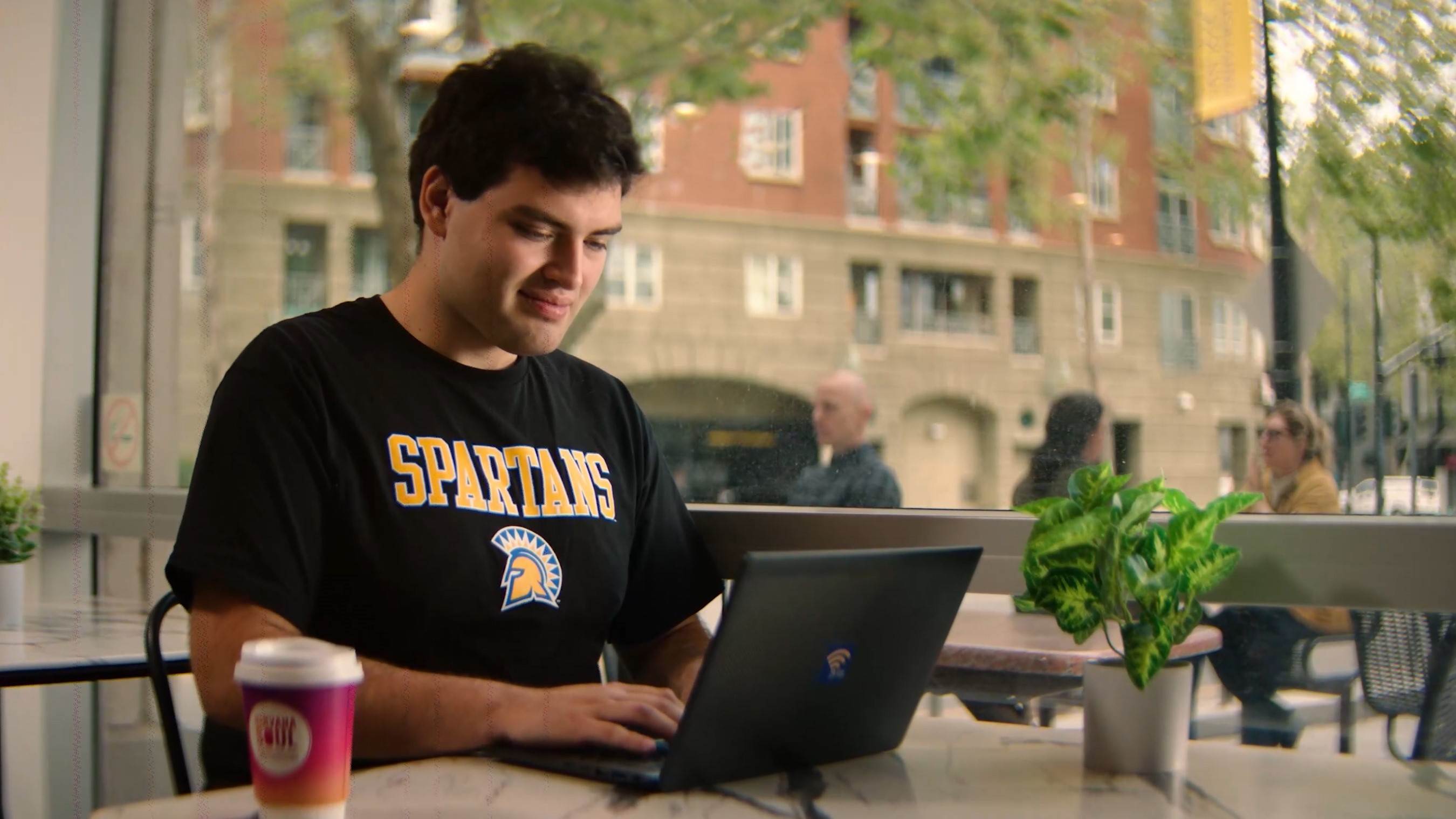 SJSU Online student accessing virtual resources on a laptop