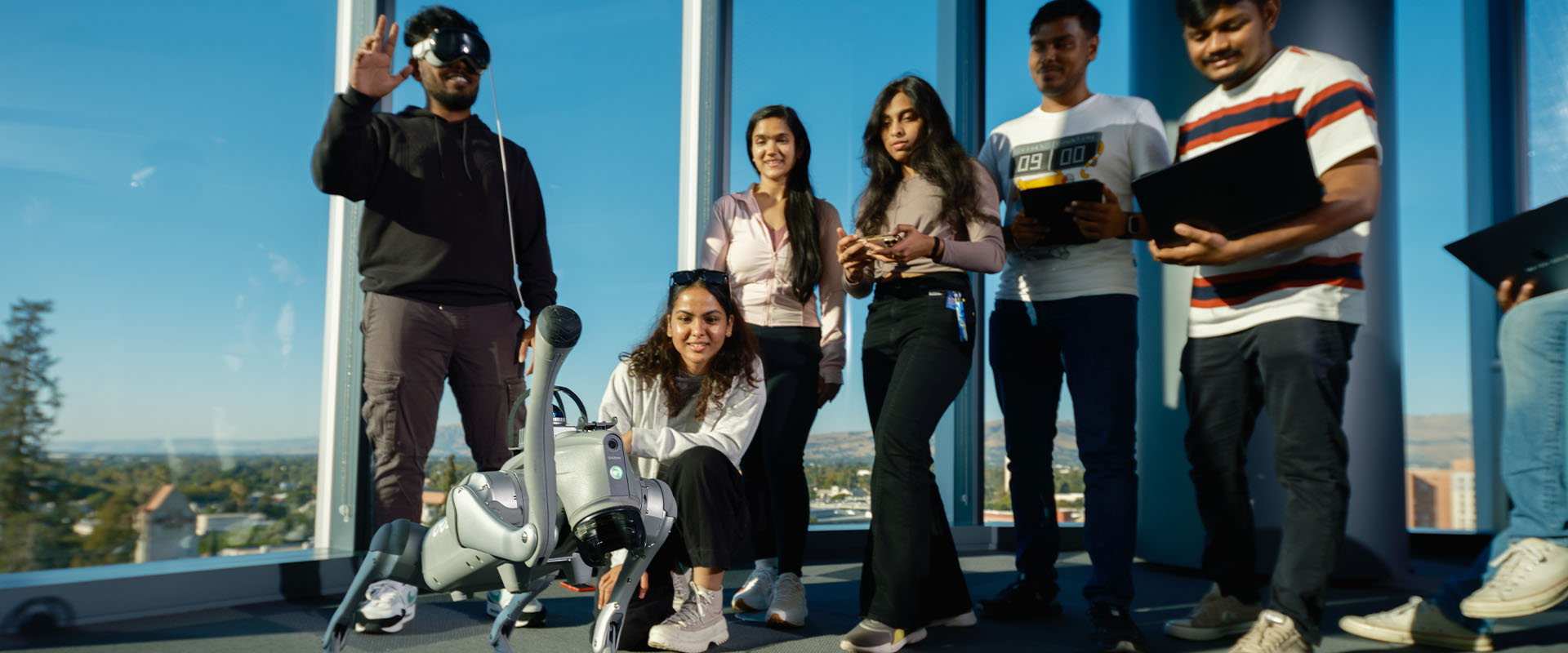 SJSU student controlling a robot with a VR controller