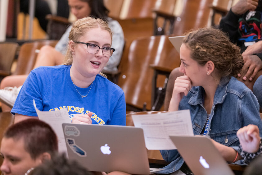 Students checking registration calendar 