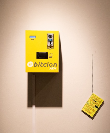 Anxious to Make (Liat Berdugo + Emily Martinez) Bitcoin Futures, 2018 Wood, electronics, LCD display, thermal printer, digital coin acceptor, paint  Seeing Blocks and Crypto Bros, 2018 Artist book Courtesy the artists (Liat Berdugo + Emily Martinez)